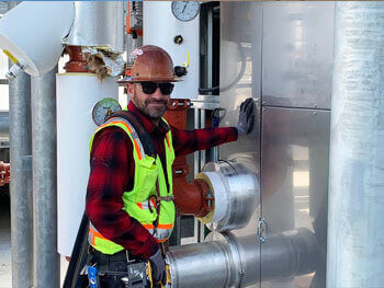 Air System technician installing a LEED certified system